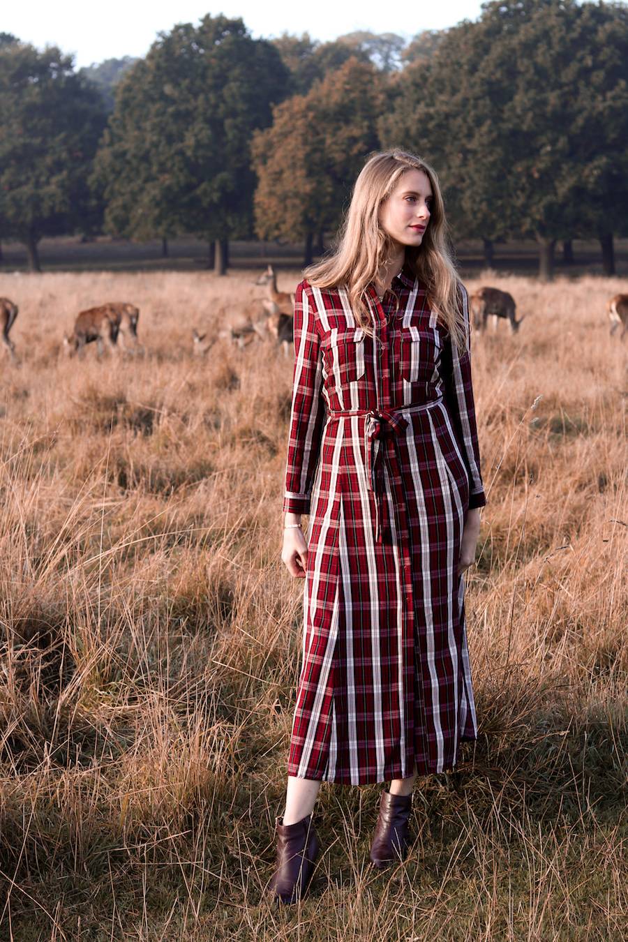 Girl next to deer